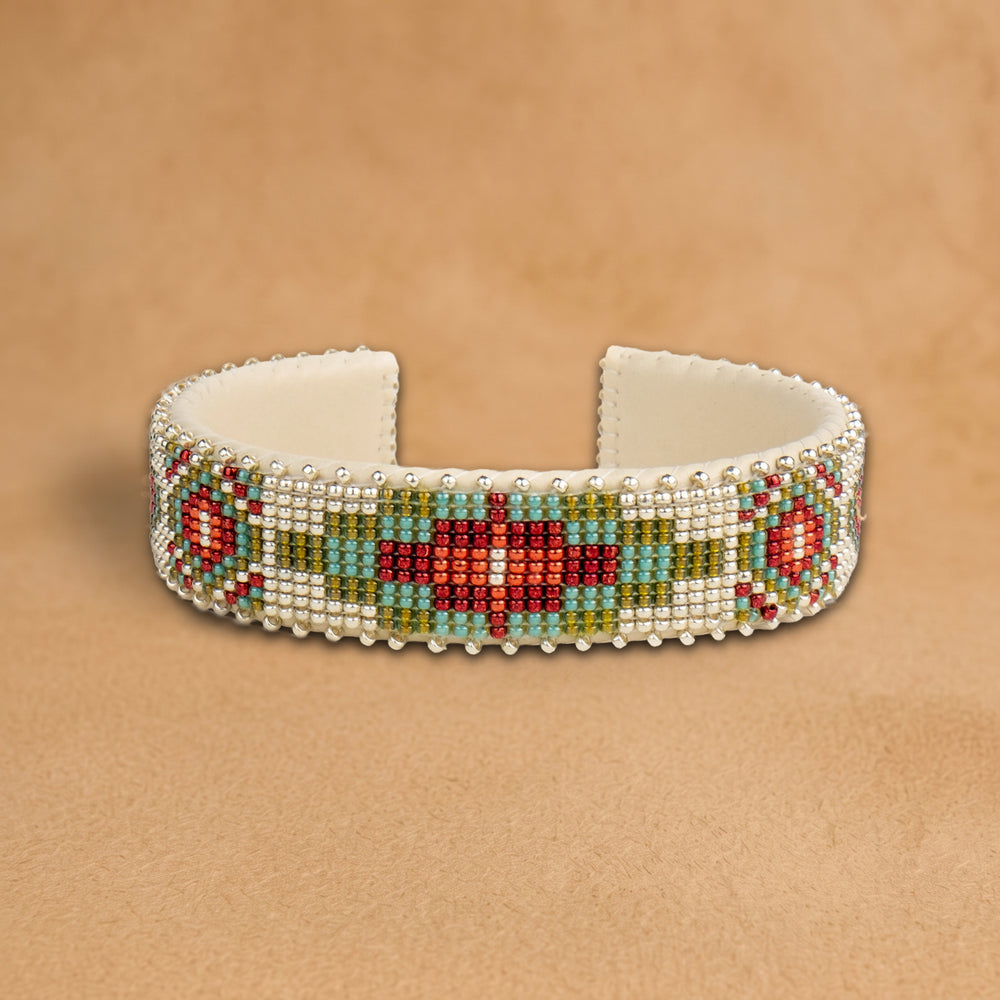 Becca Medium beaded cuff, white beads with a red, turquoise and olive green medallion and red diamonds, handloomed by Navajo artisans in New Mexico