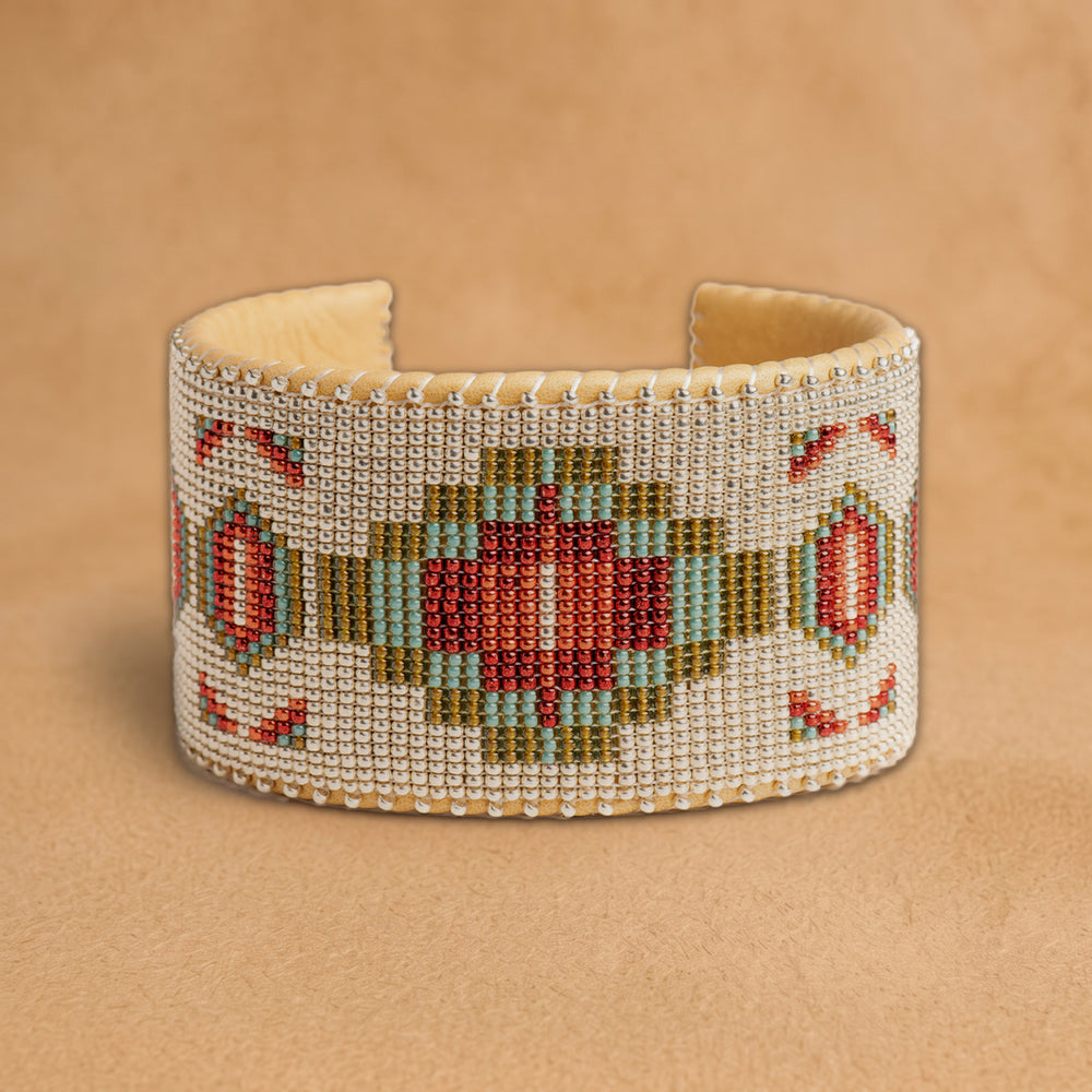 Becca X Large beaded cuff, white beads with a red, turquoise and olive green medallion and red diamonds, handloomed by Navajo artisans in New Mexico