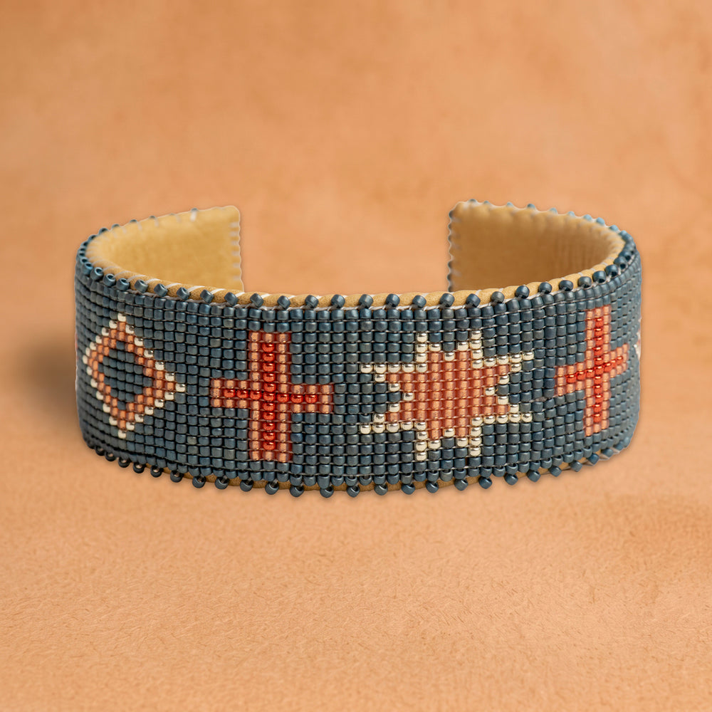 Belle Large beaded cuff, slate blue with coral crosses, an eight-point star and diamonds, handloomed by Navajo artisans in New Mexico