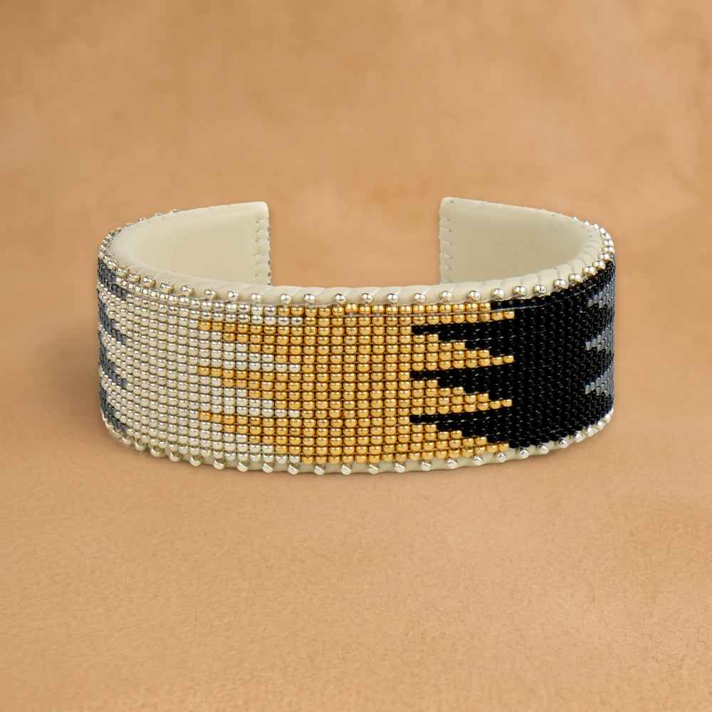 Coco Large beaded cuff, white, gold and black flame pattern, handloomed by Navajo artisans in New Mexico