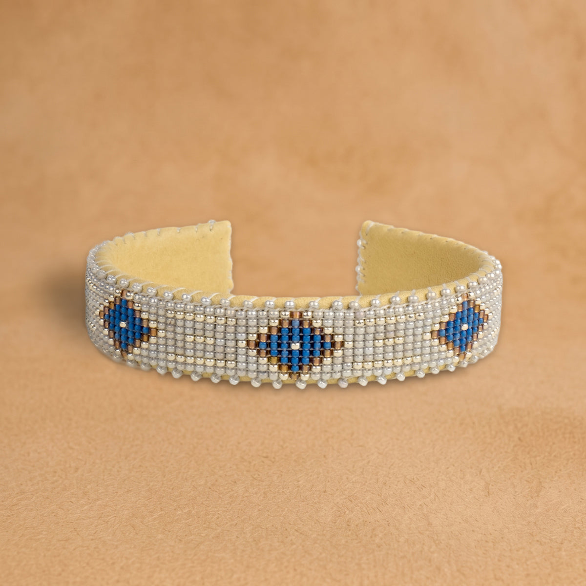 Grace Small beaded cuff, pale silver with cobalt blue diamonds outlined in gold, handloomed by Navajo artisans in New Mexico