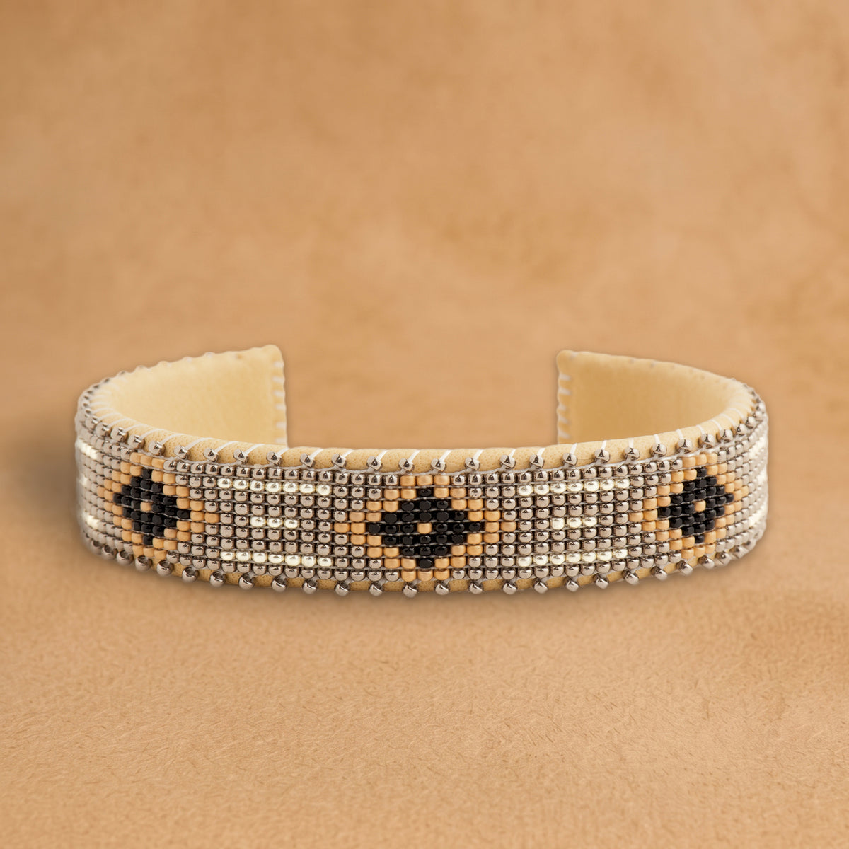 Harmony Small beaded cuff, silver with black diamonds outlined in peach, handloomed by Navajo artisans in New Mexico