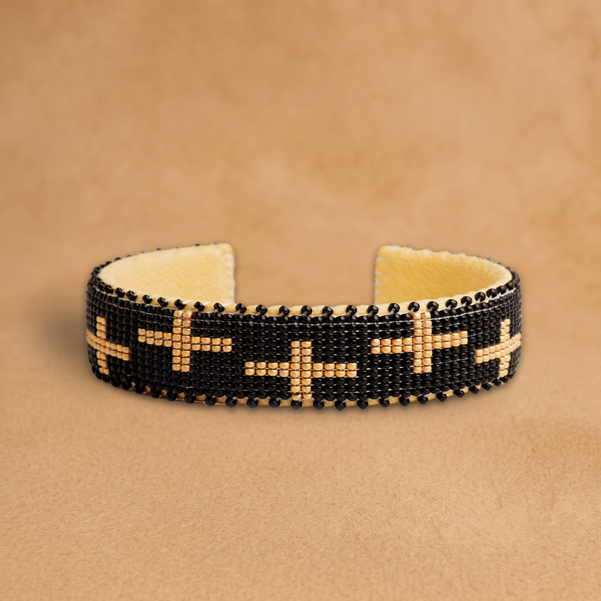Honor Medium beaded cuff, black with peach crosses, handloomed by Navajo artisans in New Mexico
