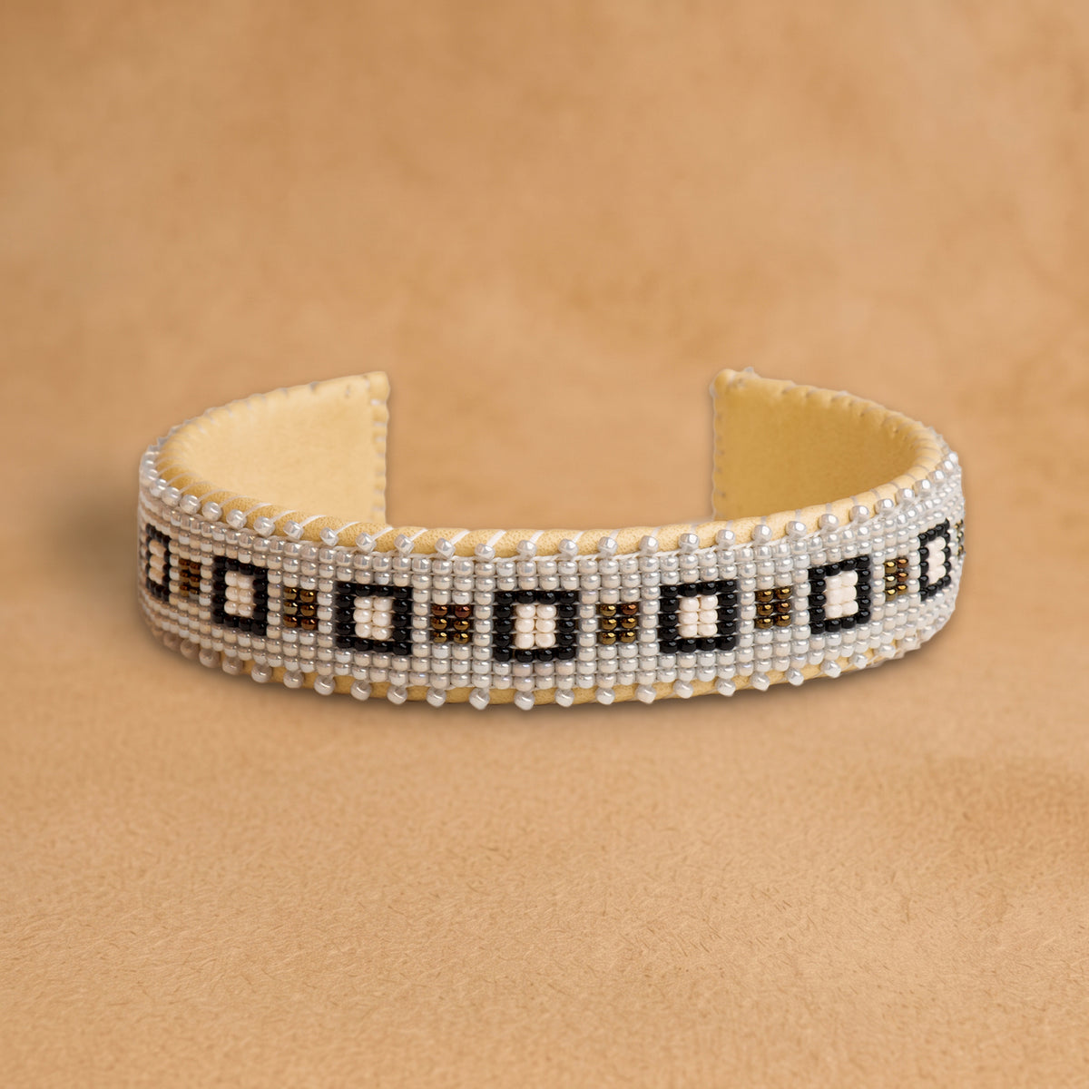 Kate Small beaded cuff, white with black and bronze squares, handloomed by Navajo artisans in New Mexico