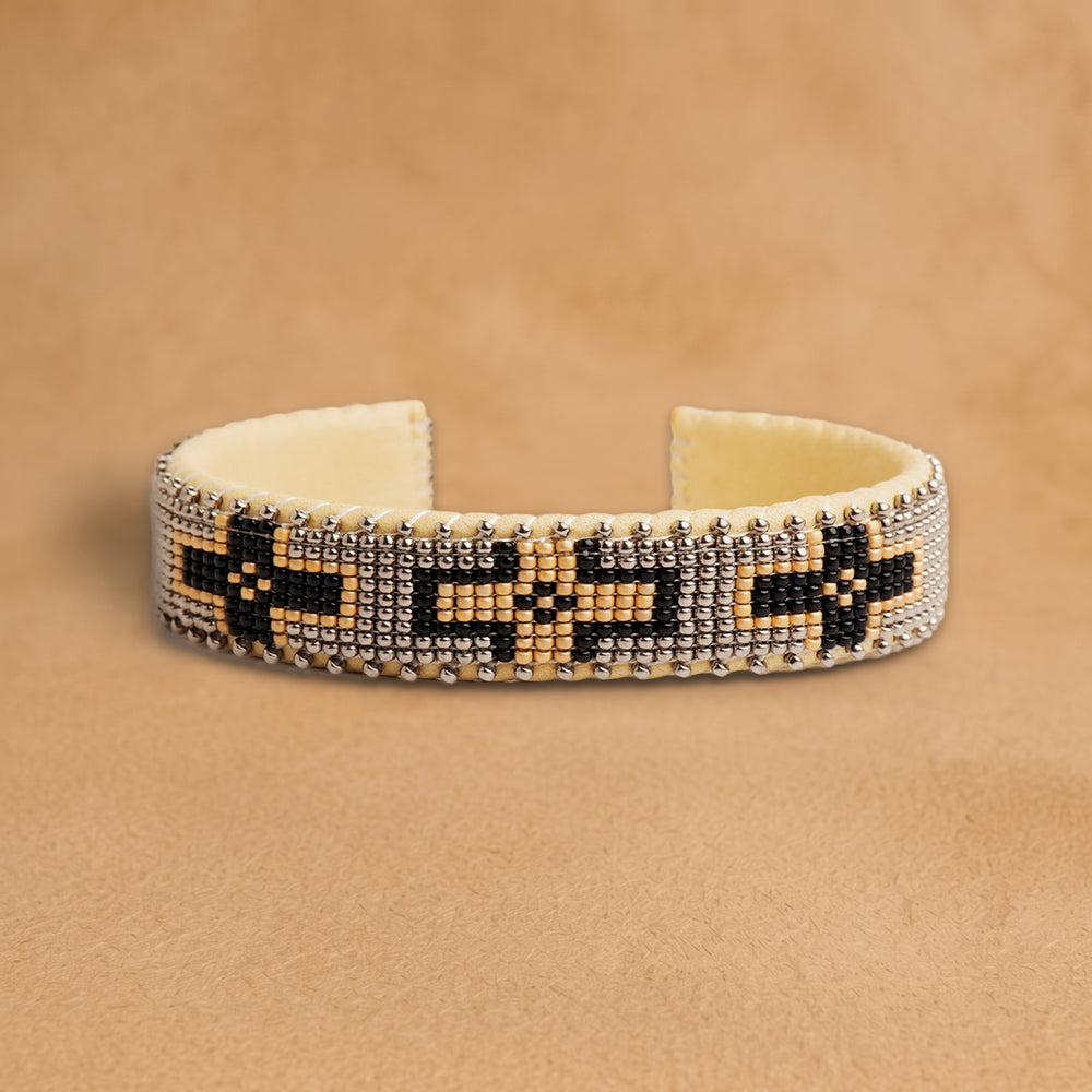 Maize Small beaded cuff, silver-grey with black and peach crosses, handloomed by Navajo artisans in New Mexico