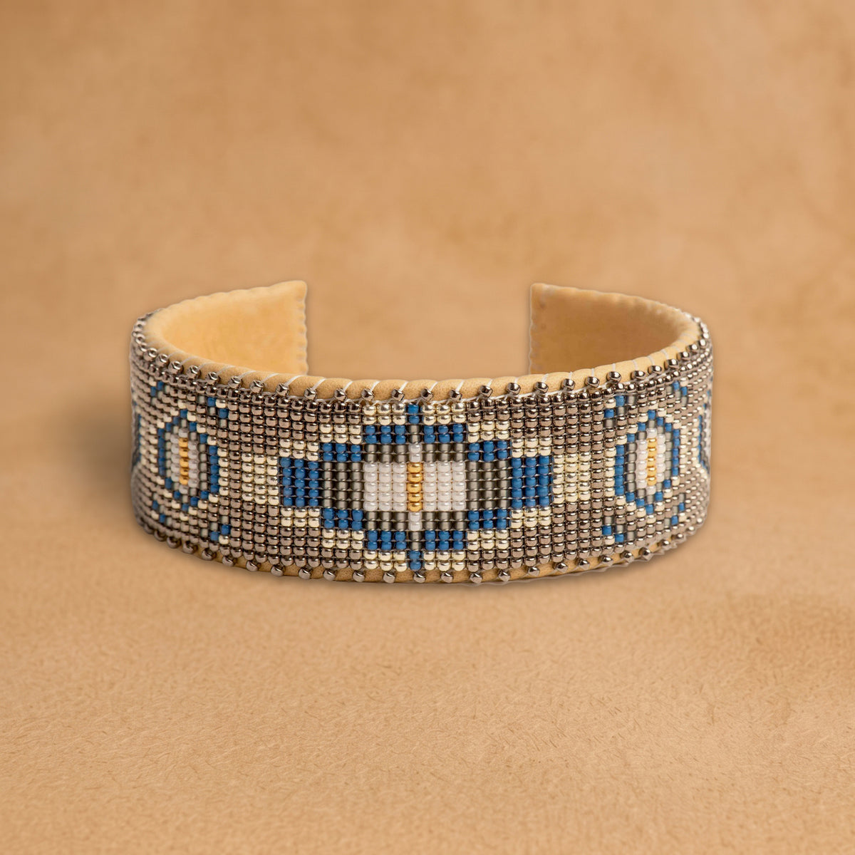 Paloma Large beaded cuff, taupe with a cobalt blue, black and cream medallion, handloomed by Navajo artisans in New Mexico