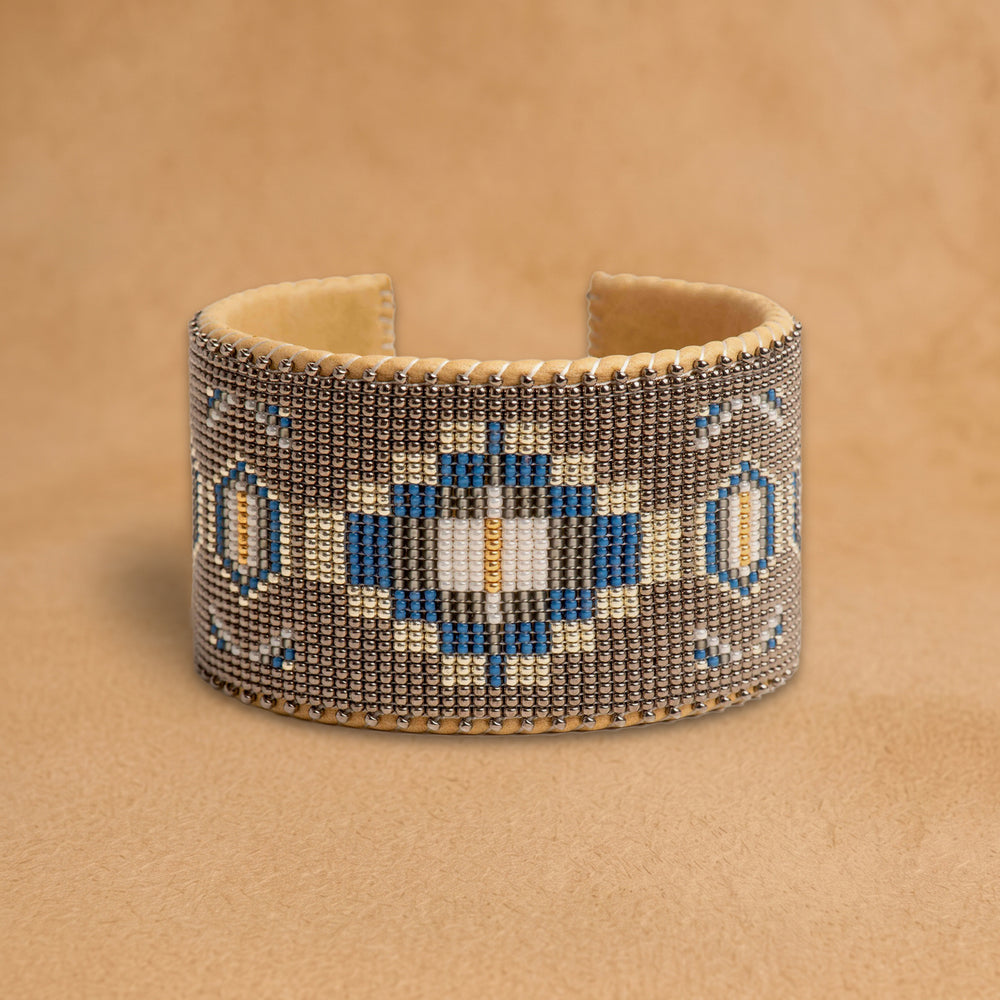 Paloma X Large beaded cuff, taupe with a cobalt blue, black and cream medallion, handloomed by Navajo artisans in New Mexico