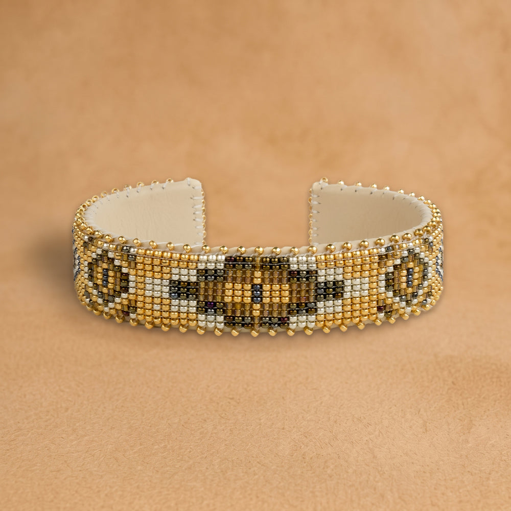 Sahara Medium beaded cuff, gold with a bronze and olive medallion, handloomed by Navajo artisans in New Mexico