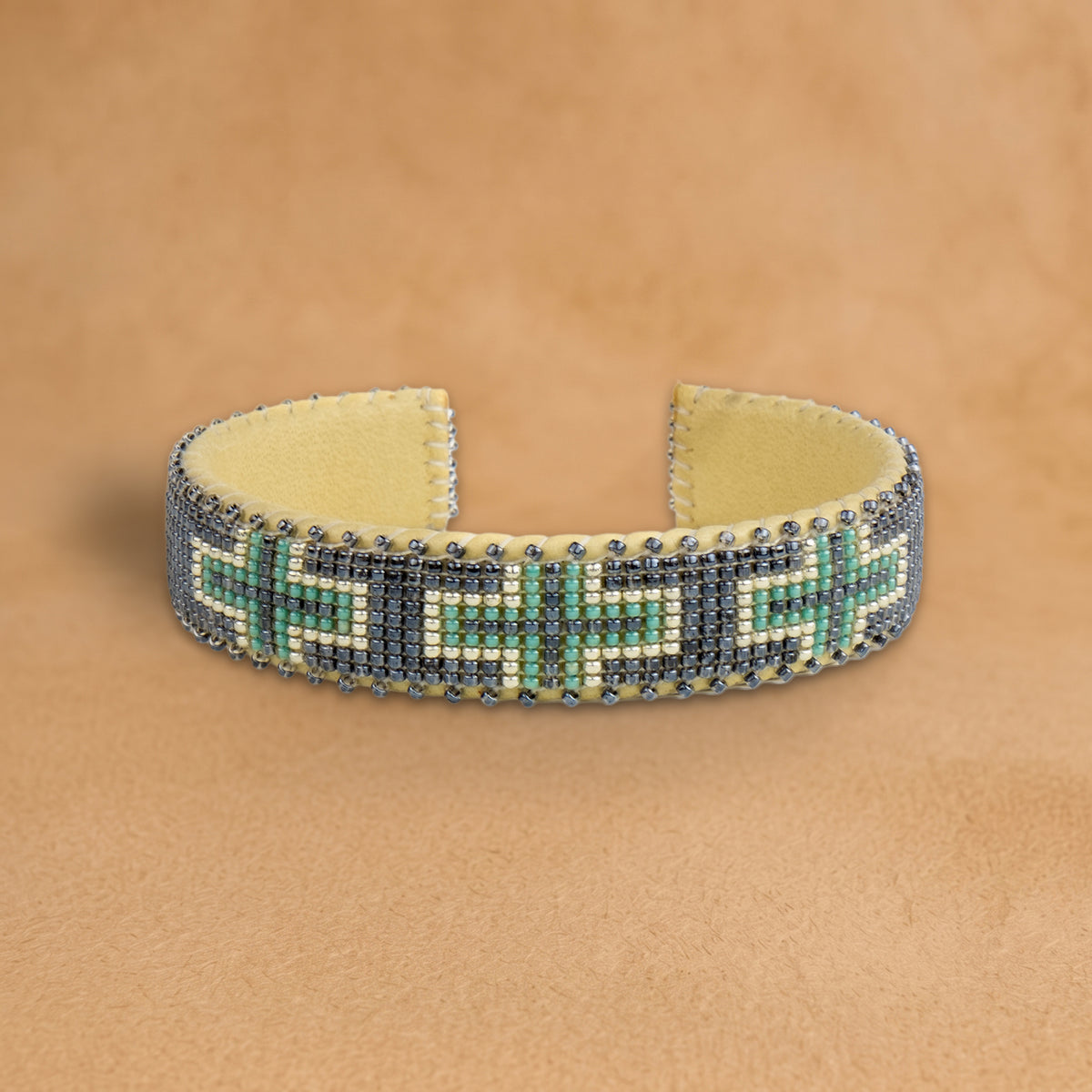 Tia Small beaded cuff, slate grey with turquoise and white crosses, handloomed by Navajo artisans in New Mexico