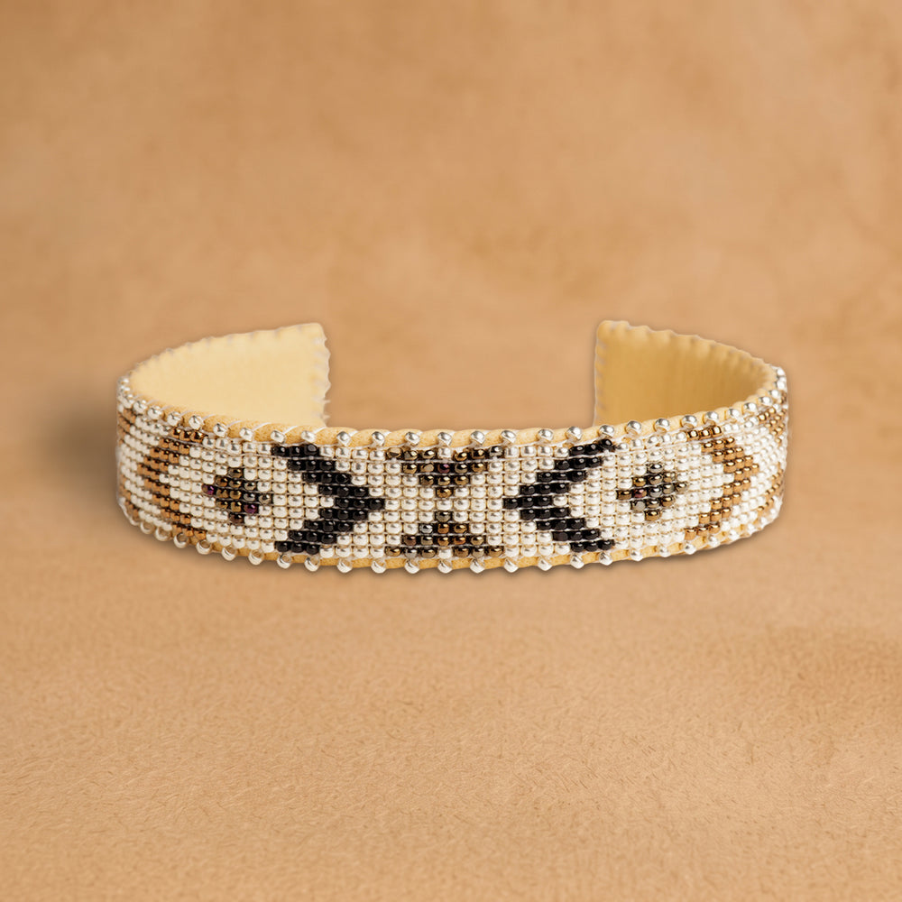 Winter Small beaded cuff, white with black and bronze chevrons and diamonds, handloomed by Navajo artisans in New Mexico