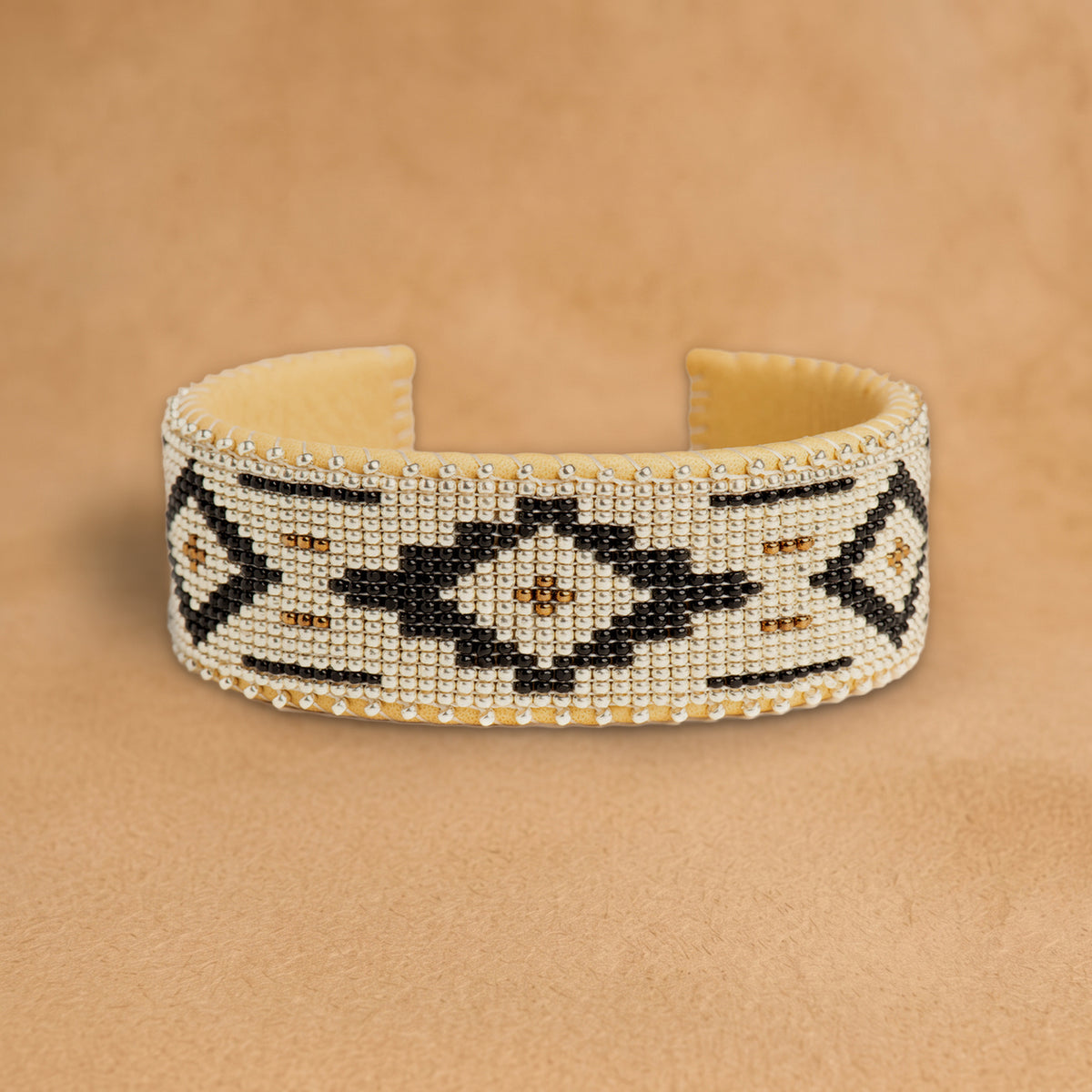 Zaylee Large beaded cuff, white with black diamonds and bronze accents, handloomed by Navajo artisans in New Mexico